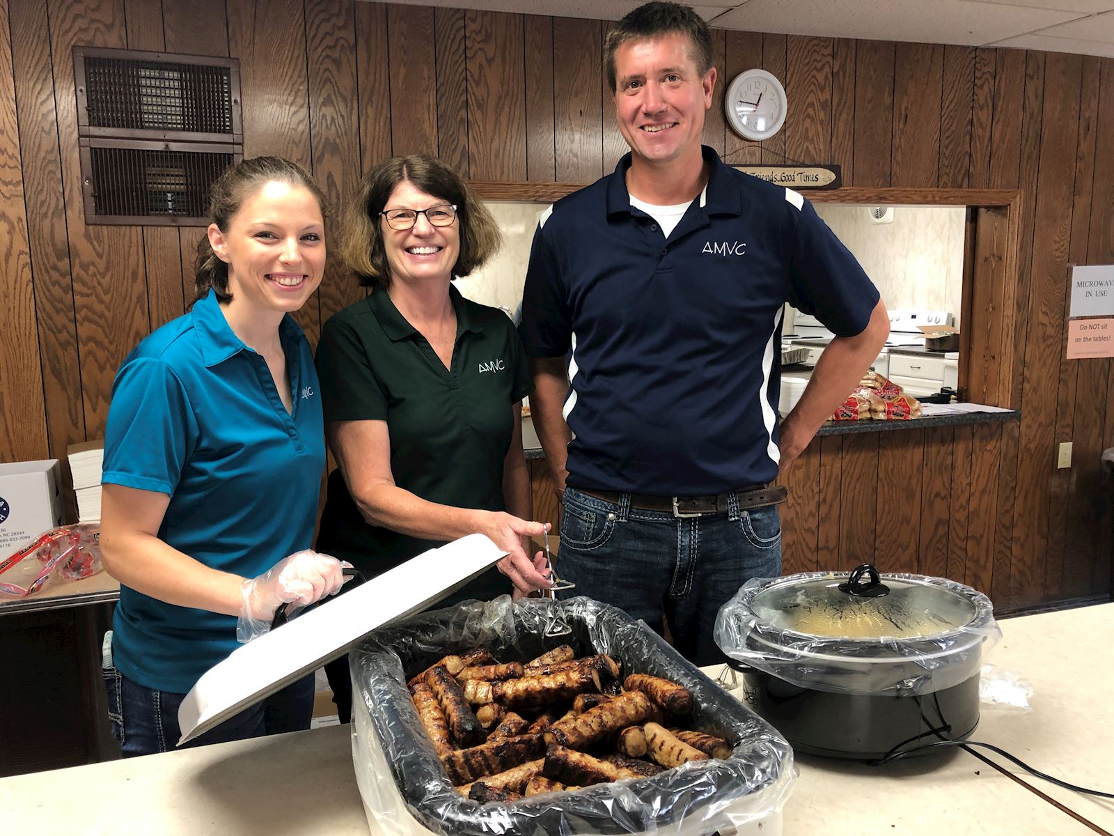 AMVC Manning staff serve brats 