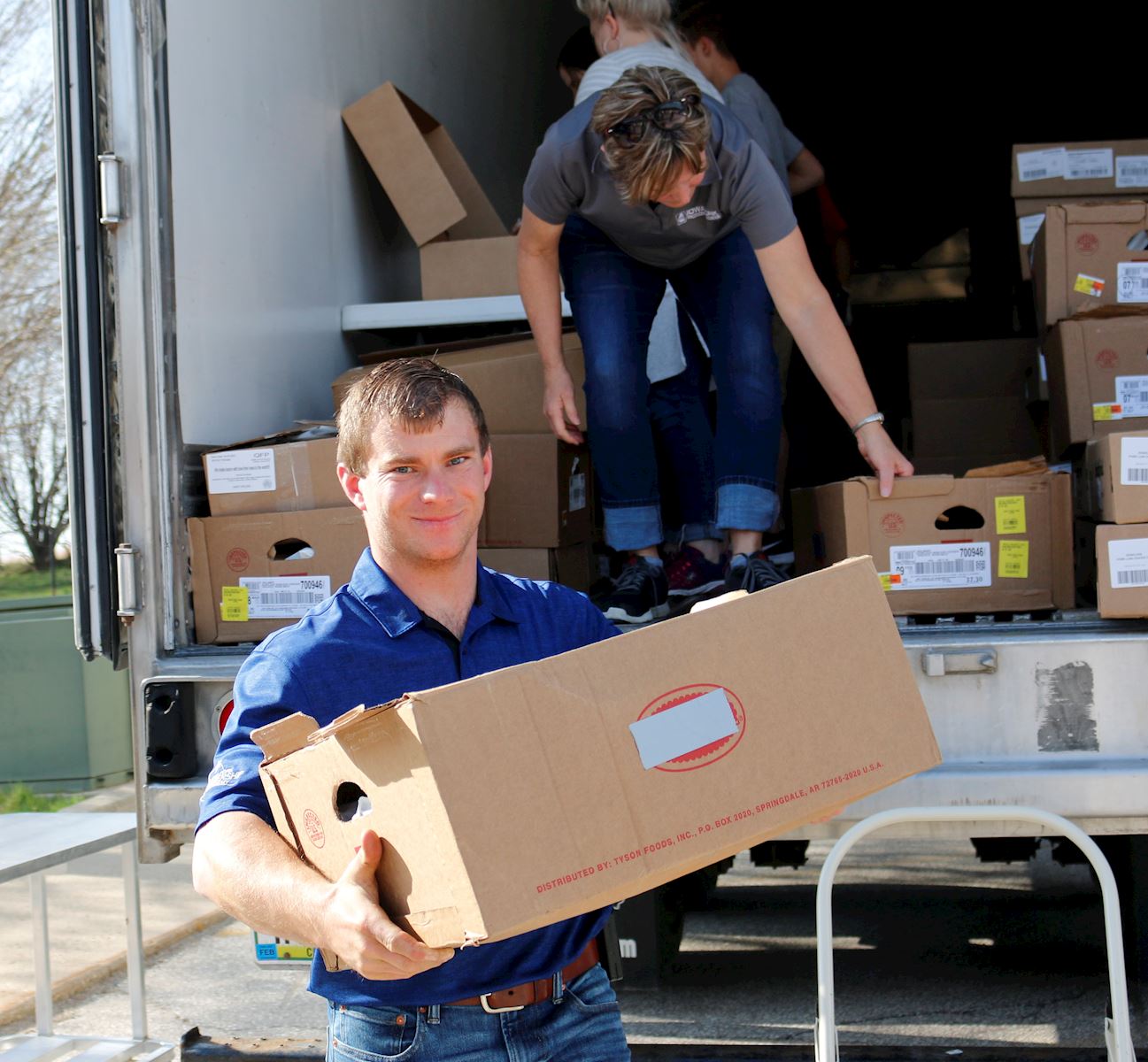 Brian Lundell helps deliver pork 